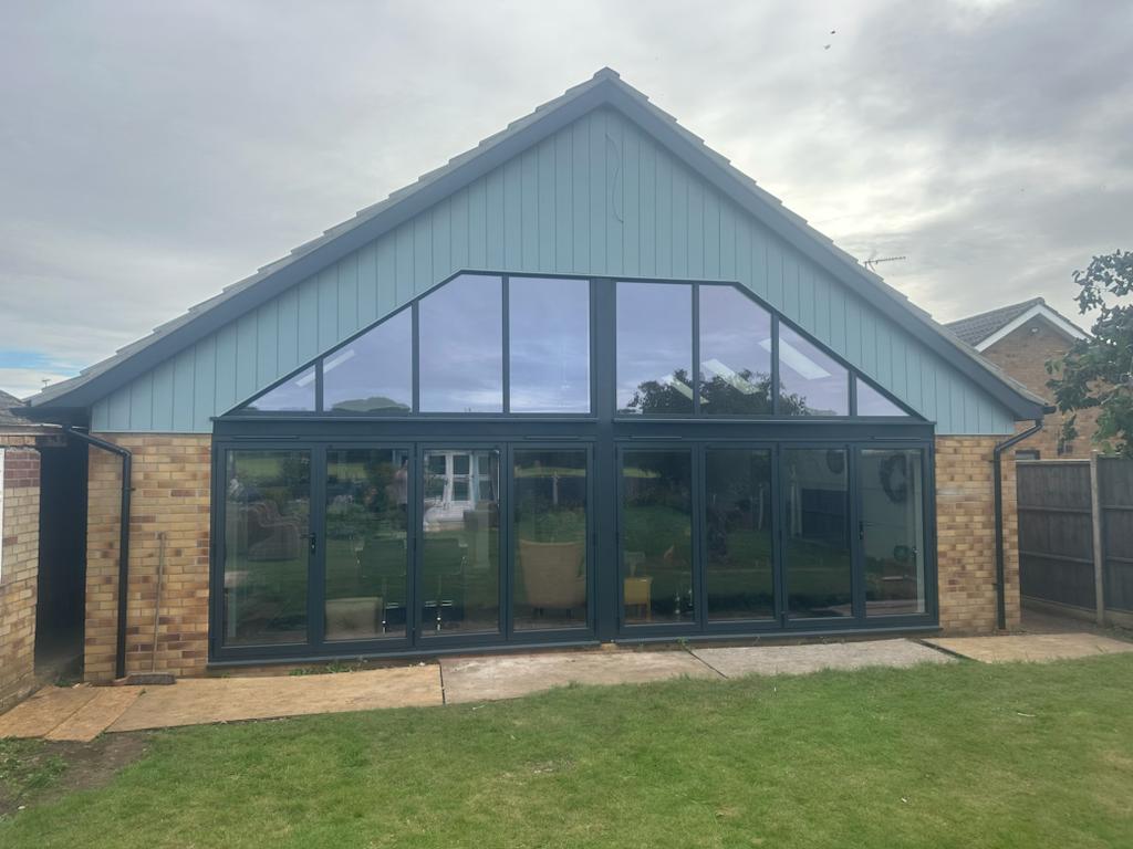 Here we have 2 anthracite aluminium bifolds with aluminium gable frames attached.